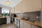 Großzügige 4,5-Zimmer-Wohnung mit ca. 117 m² Wohnfläche, sonnigem Balkon und Tiefgaragenstellplatz - Küche (2)